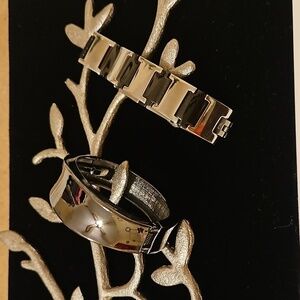 2 black metallic stainless bracelets